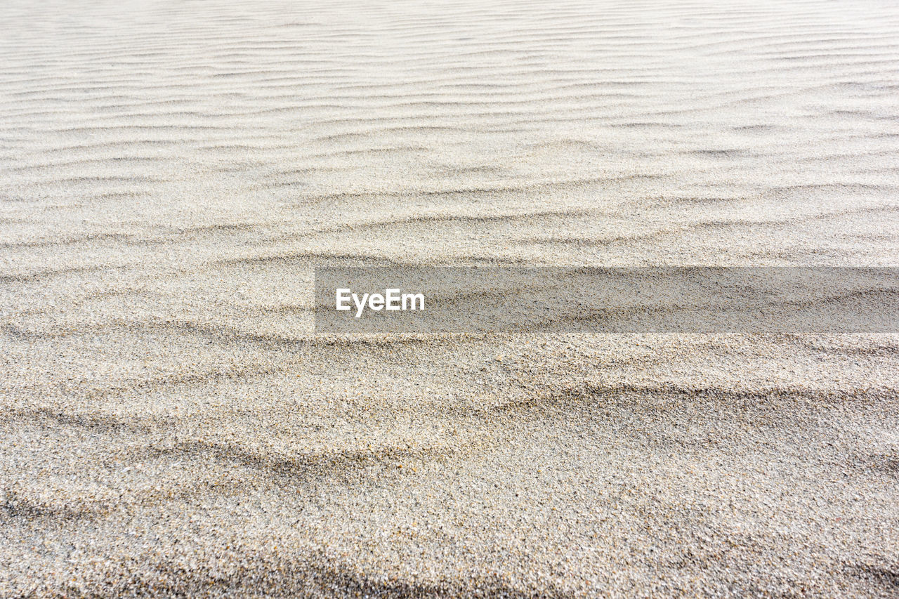 FULL FRAME SHOT OF SAND ON BEACH