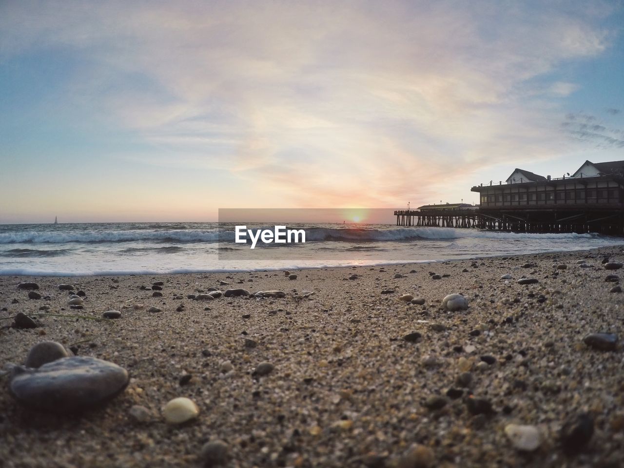 Scenic view of beach at sunset