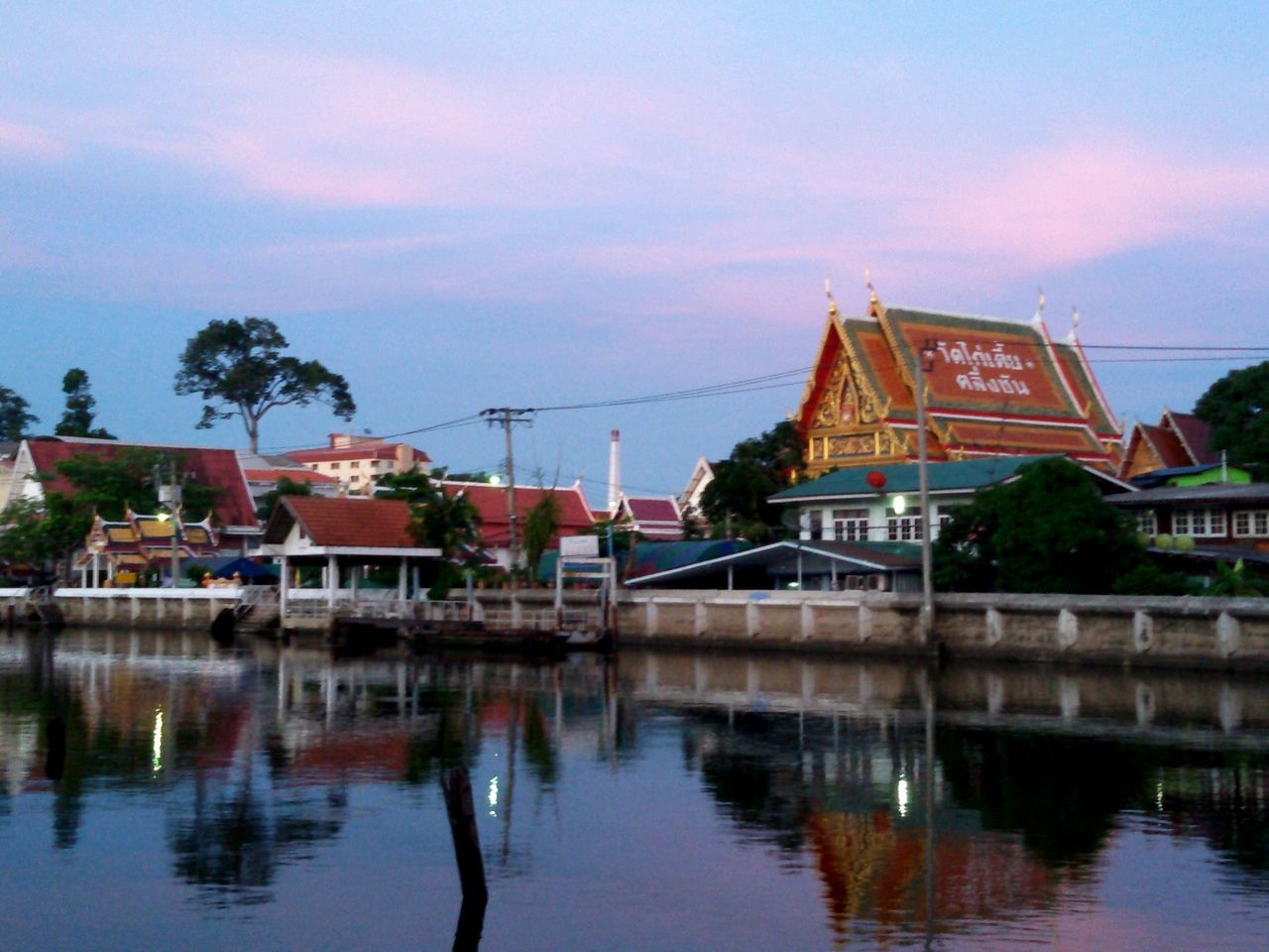 VIEW OF RIVER WITH BUILDINGS IN BACKGROUND