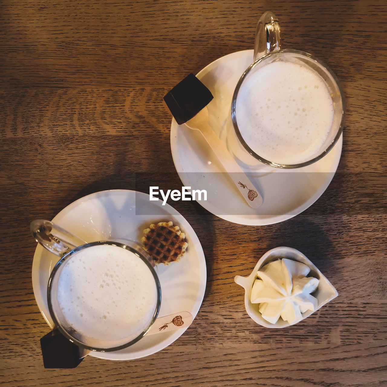 HIGH ANGLE VIEW OF COFFEE CUP ON TABLE WITH SPOON