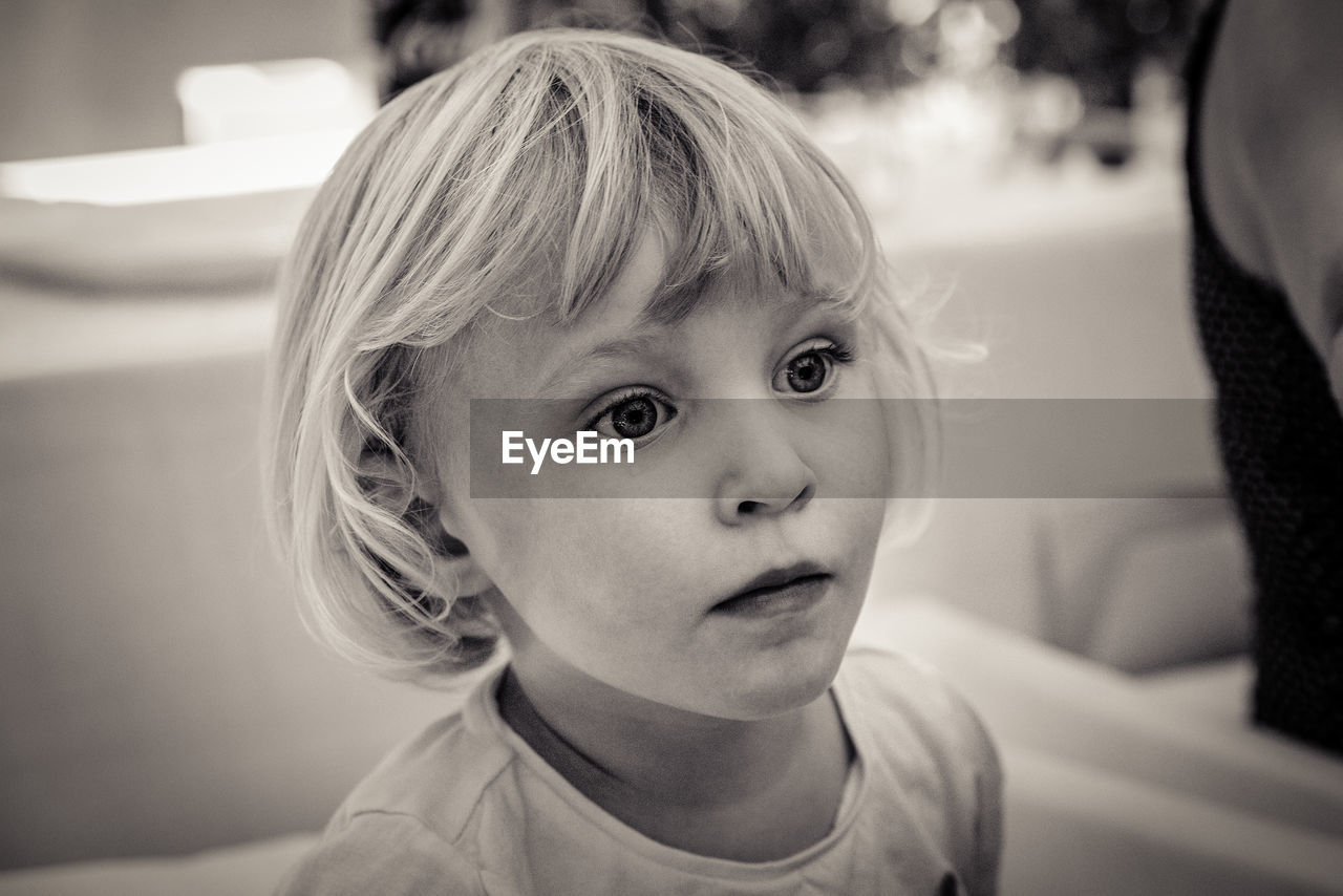 Close-up of cute girl at home