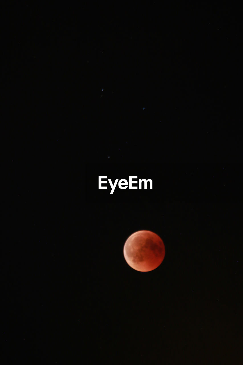 LOW ANGLE VIEW OF MOON AT NIGHT