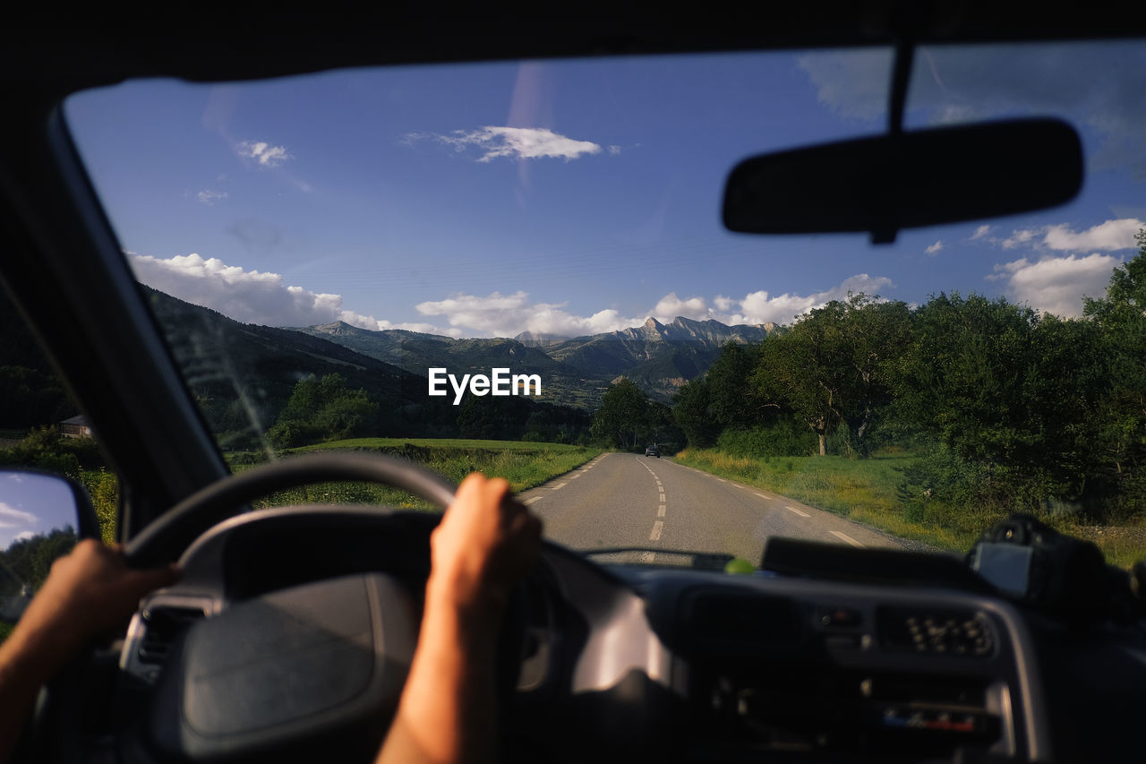  man driving car on road