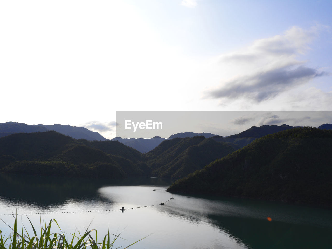 water, mountain, sky, scenics - nature, lake, beauty in nature, nature, mountain range, reflection, environment, tranquility, cloud, tranquil scene, no people, landscape, reservoir, plant, body of water, travel destinations, non-urban scene, travel, day, outdoors, land, idyllic, highland, tourism, tree, forest