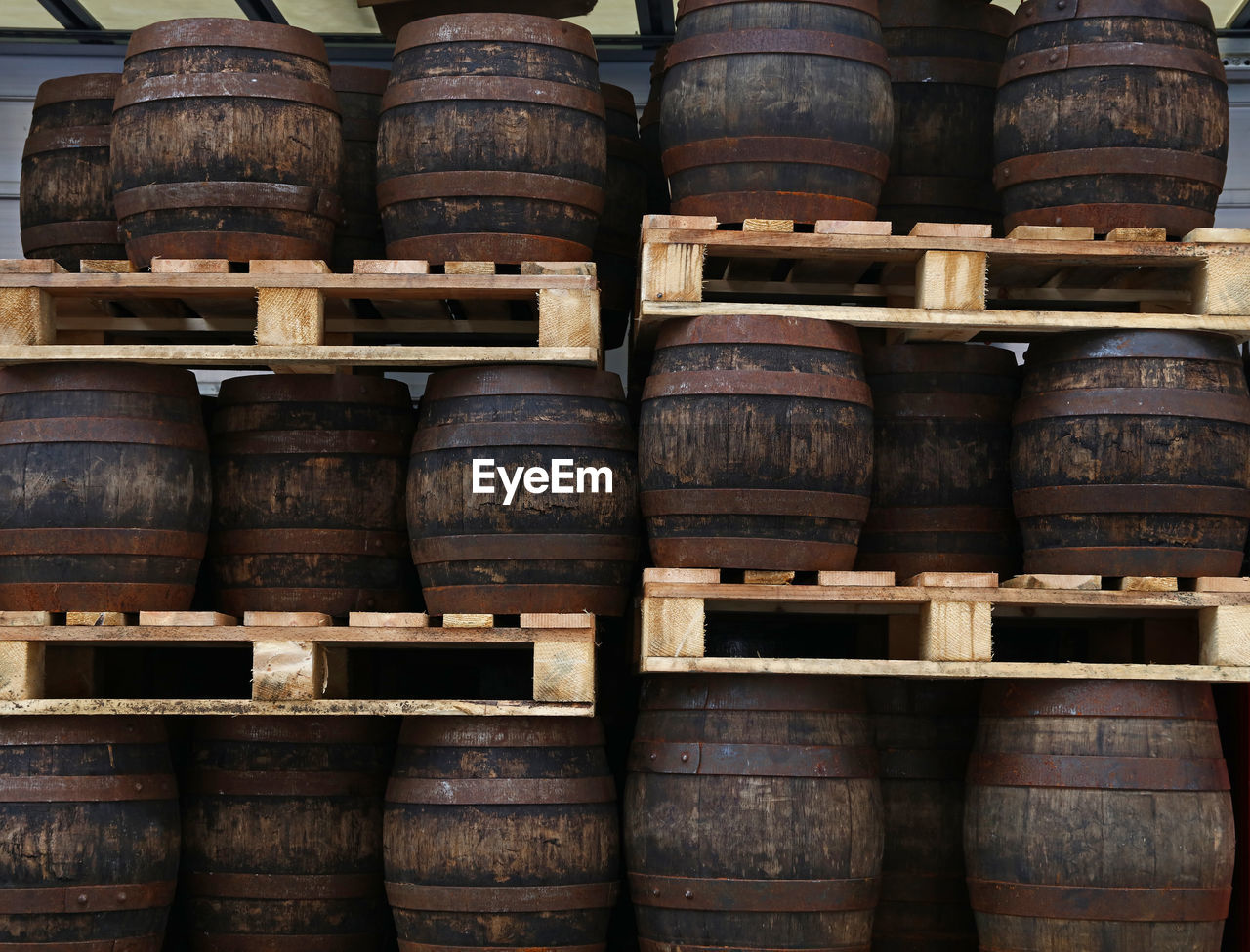 Close-up of barrels in warehouse