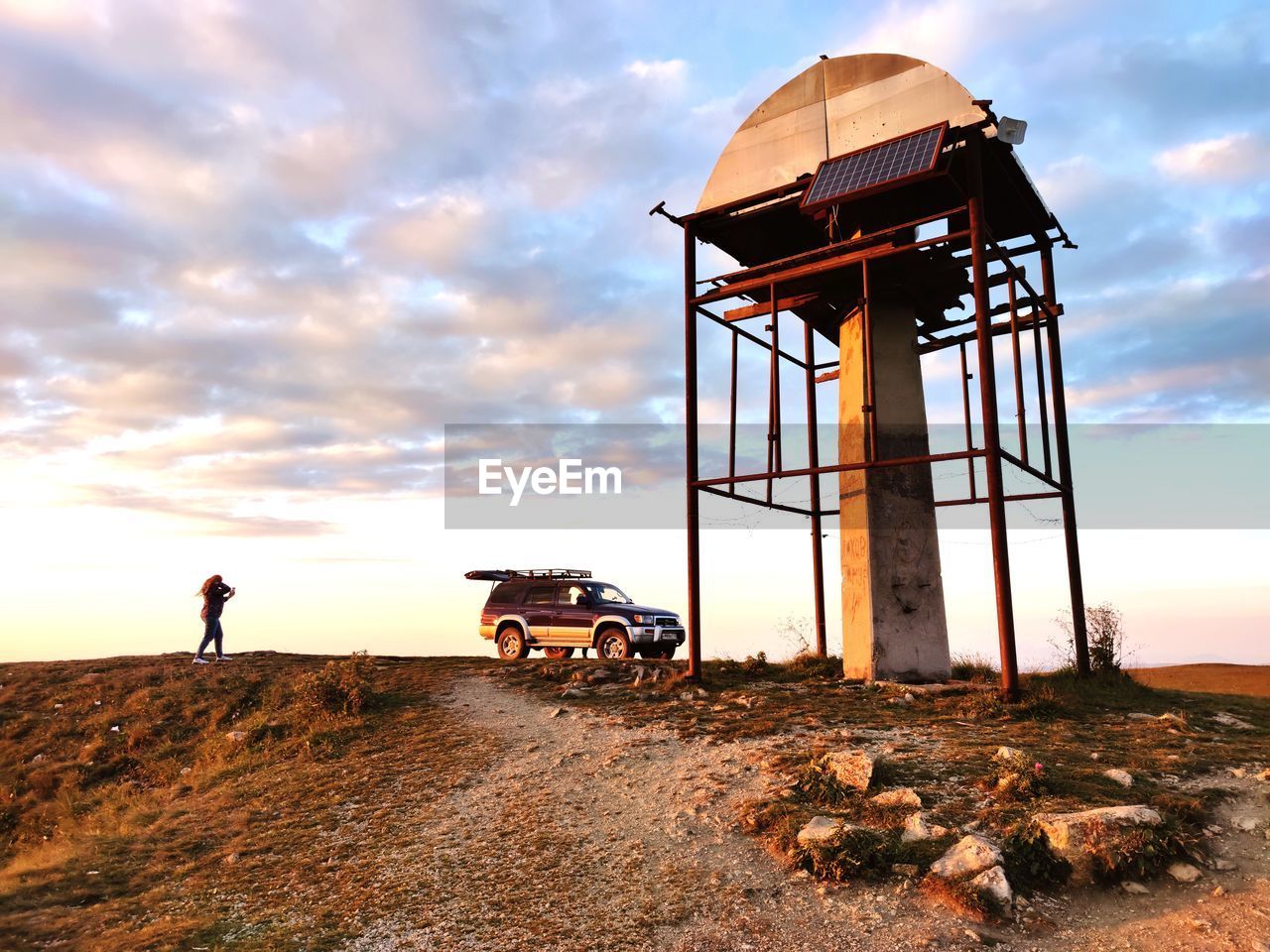 Traditional water tower at the pass in the caucasus mountains against the sky during sunset