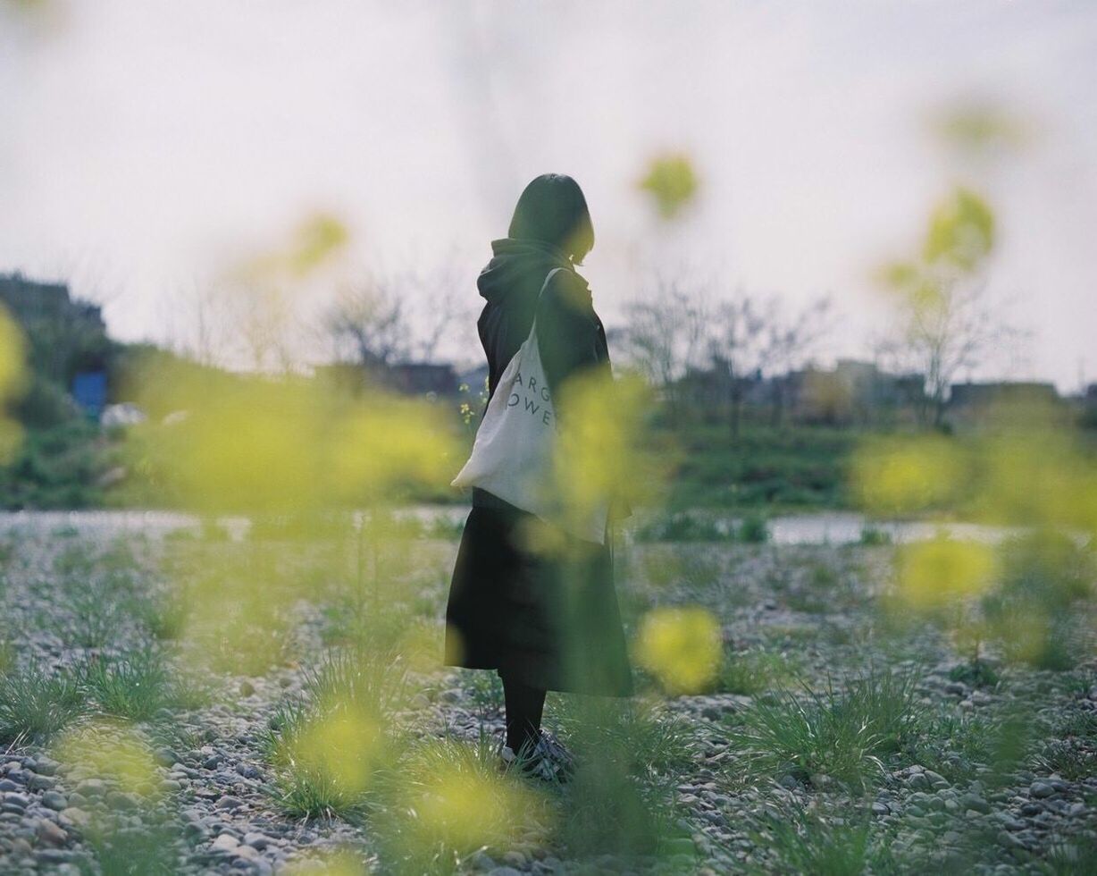 WOMAN WITH UMBRELLA ON TREE