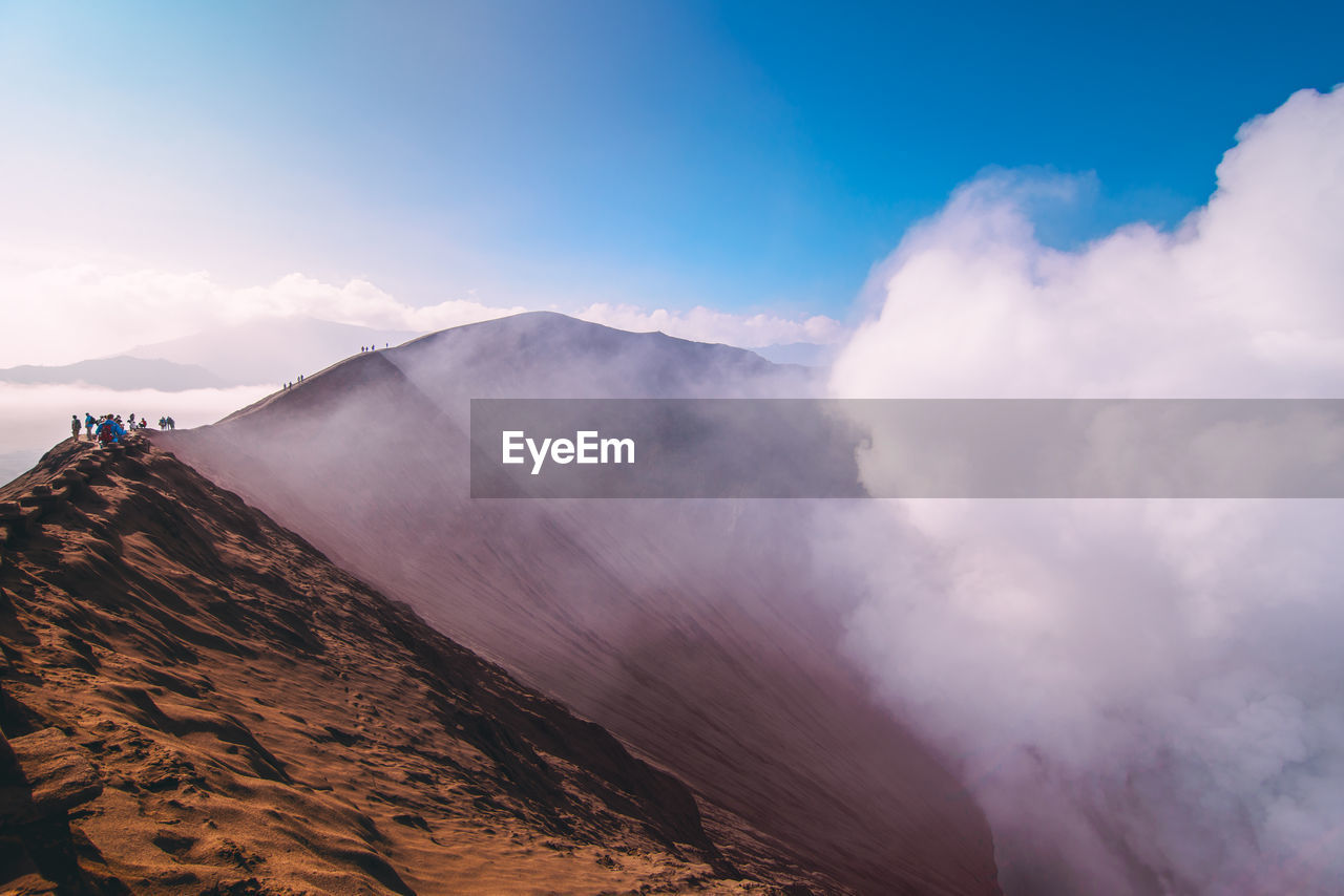 Scenic view of mountains amidst clouds
