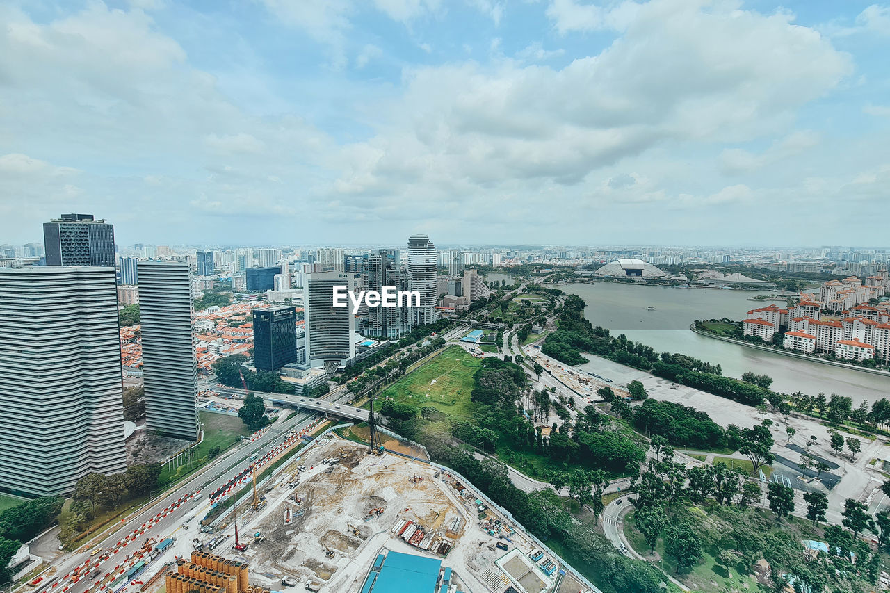 High angle view of buildings in city against sky