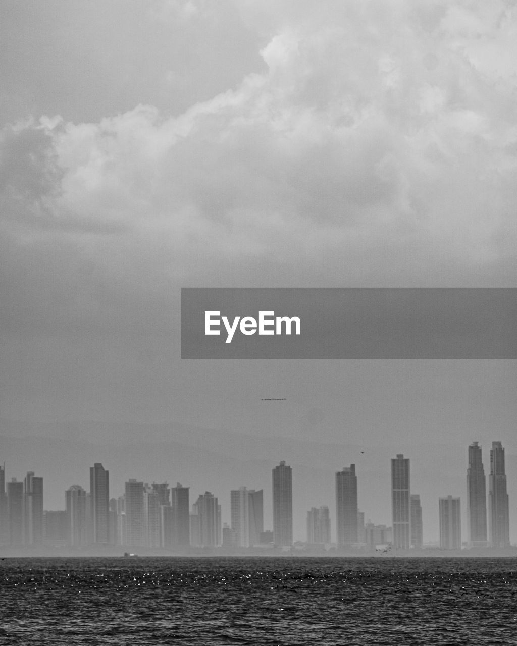 Skyline of panama city in a cloudy day seen from the water