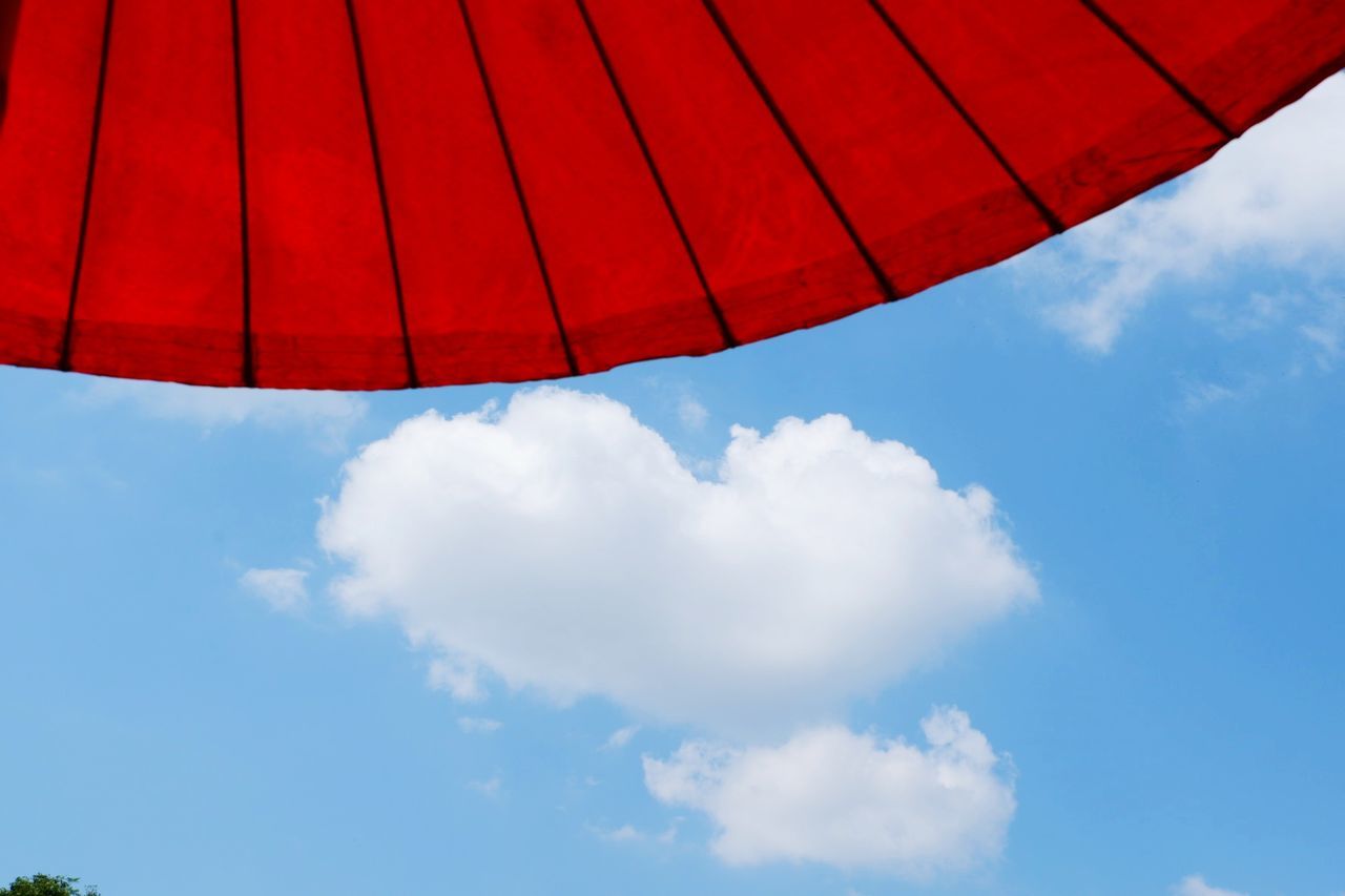 LOW ANGLE VIEW OF RED UMBRELLA AGAINST SKY