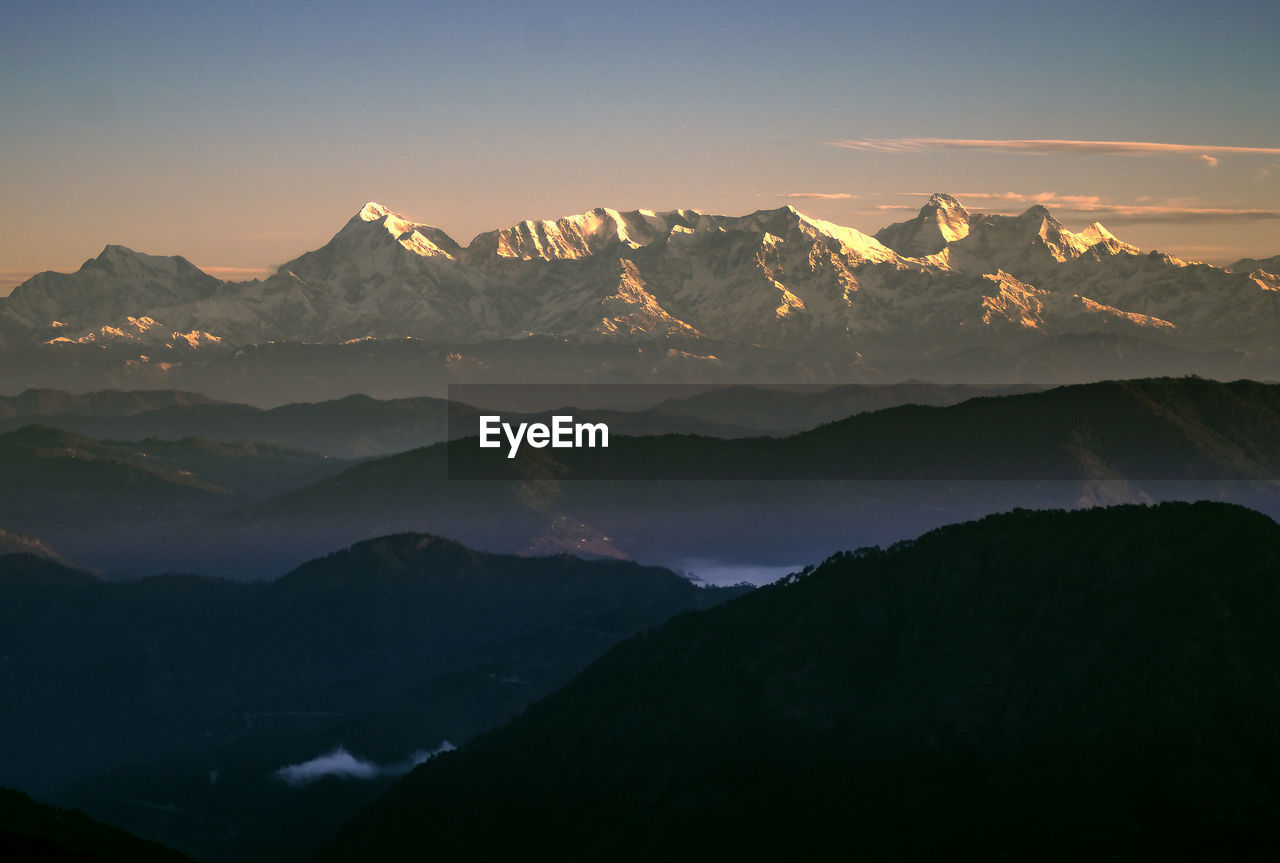 Scenic view of mountains against sky during sunset