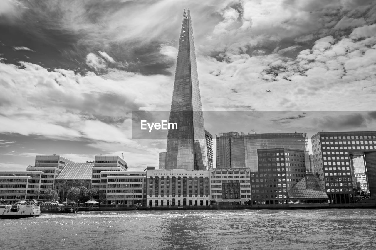 Thames waterfront view of london bridge hospital and the shard.