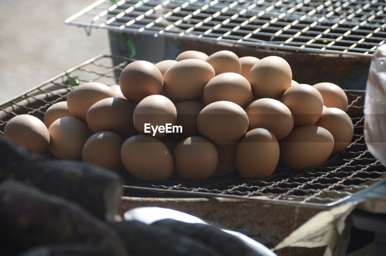 HIGH ANGLE VIEW OF EGGS IN BASKET OF MARKET