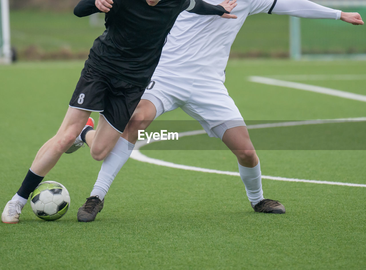 rear view of man playing soccer