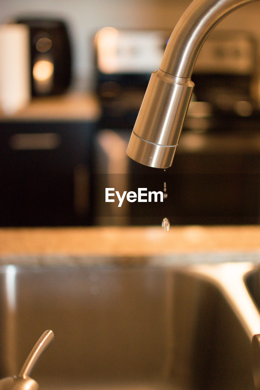 Water dripping from kitchen faucet