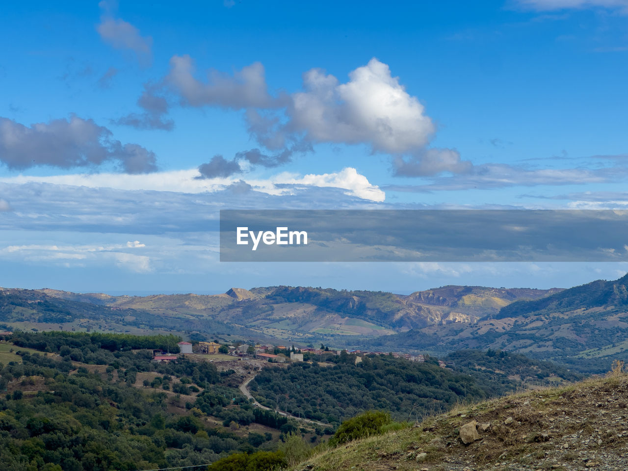 environment, landscape, sky, mountain, scenics - nature, cloud, beauty in nature, nature, land, mountain range, travel destinations, travel, no people, tranquility, blue, plant, tree, tranquil scene, outdoors, tourism, non-urban scene, wilderness, plateau, day, valley, horizon, rural scene, ridge, social issues, high angle view, idyllic, architecture, sunlight, rural area, forest, rock, remote, building