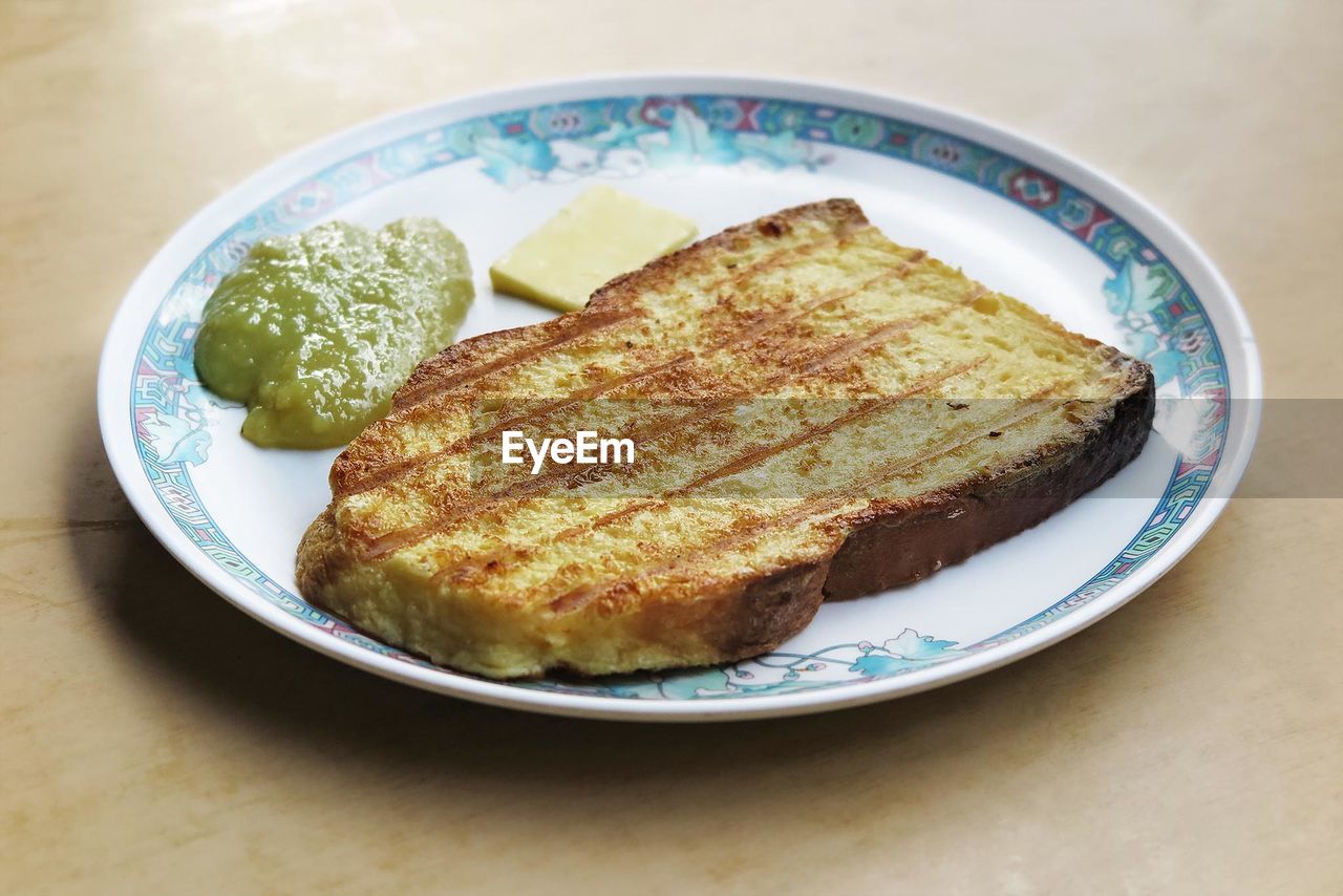 Close up view of toasted bread on plate