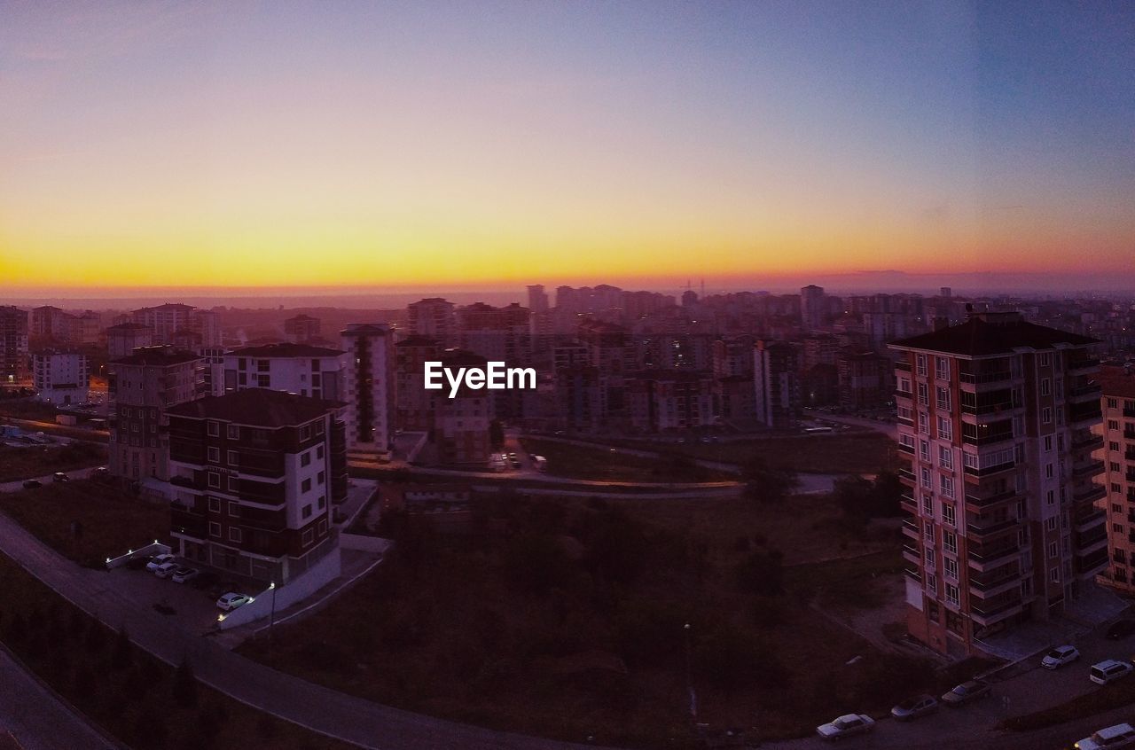 High angle view of buildings against sky during sunset