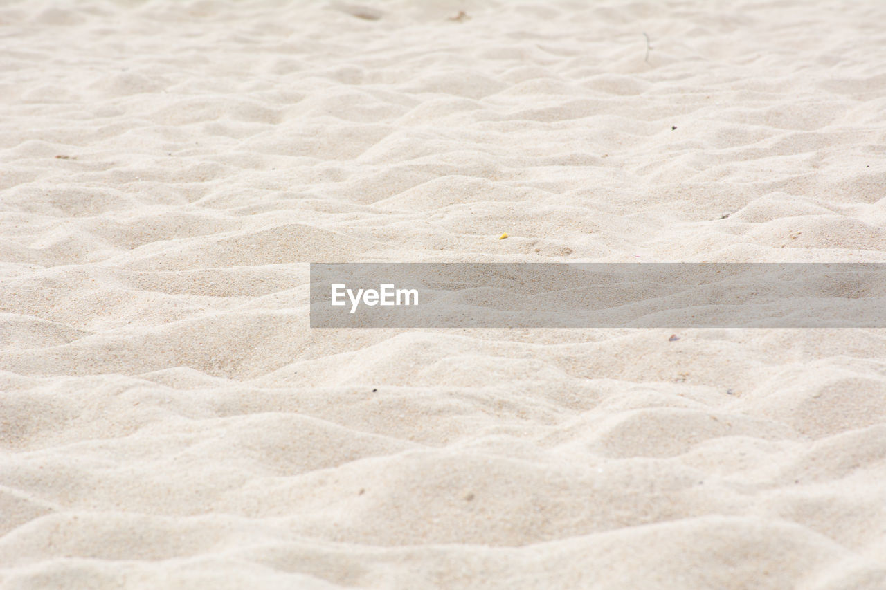 CLOSE-UP OF SAND ON BEACH