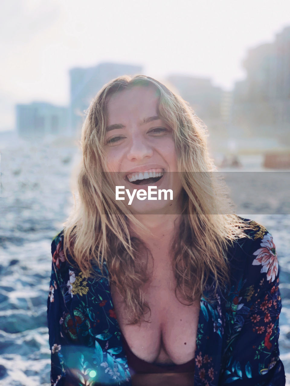 Young woman enjoying a beautiful day at the beach