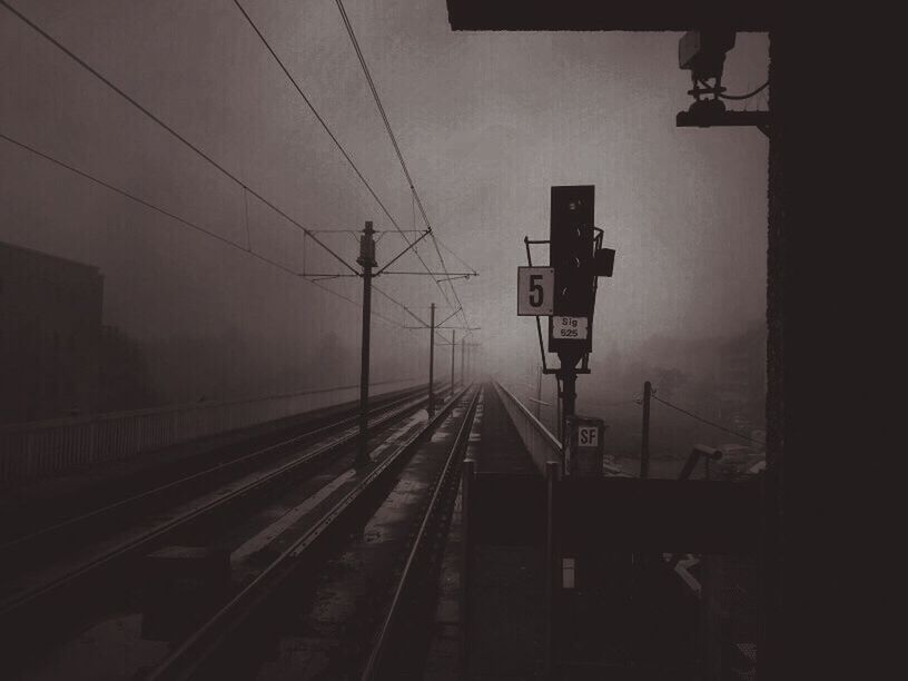 RAILROAD TRACKS AT NIGHT