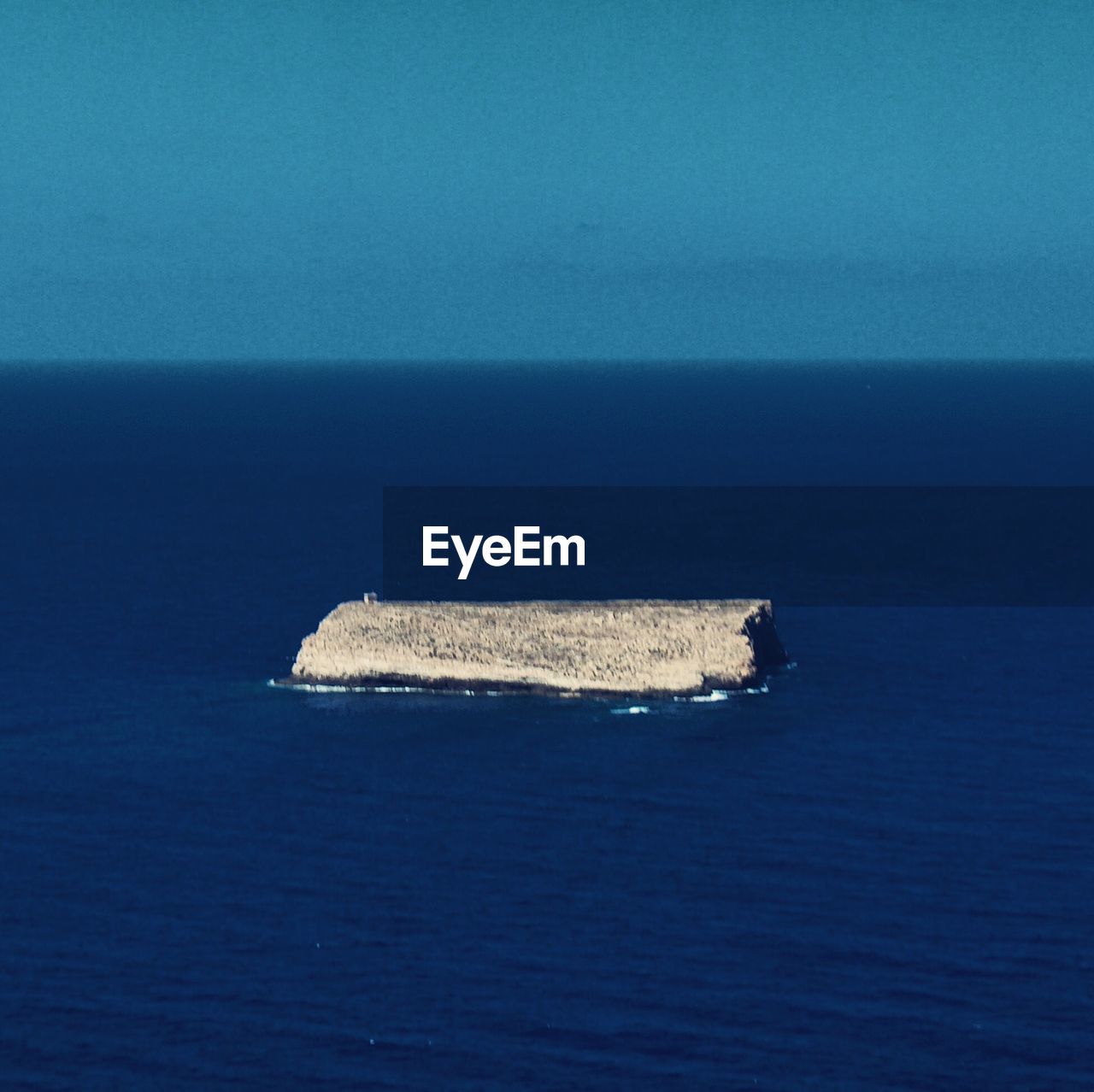 SHIP IN SEA AGAINST CLEAR BLUE SKY