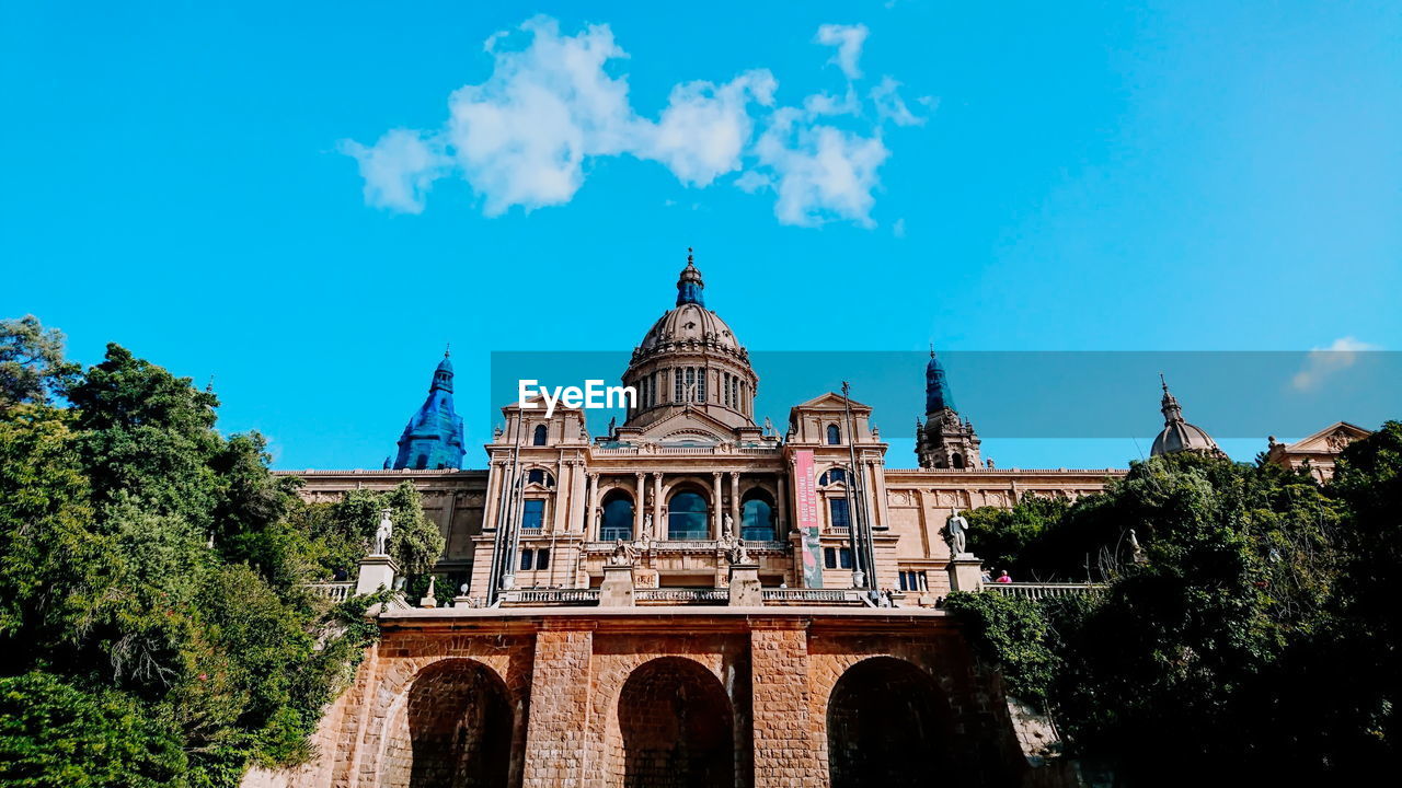 low angle view of historical building against blue sky