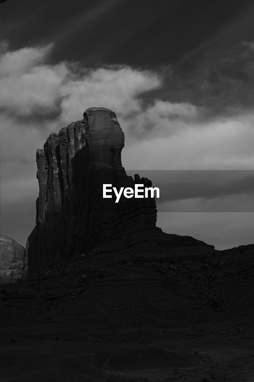 Low angle view of rock formations against sky