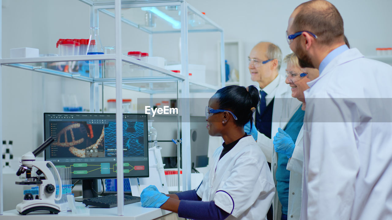 side view of doctor examining chemical in laboratory