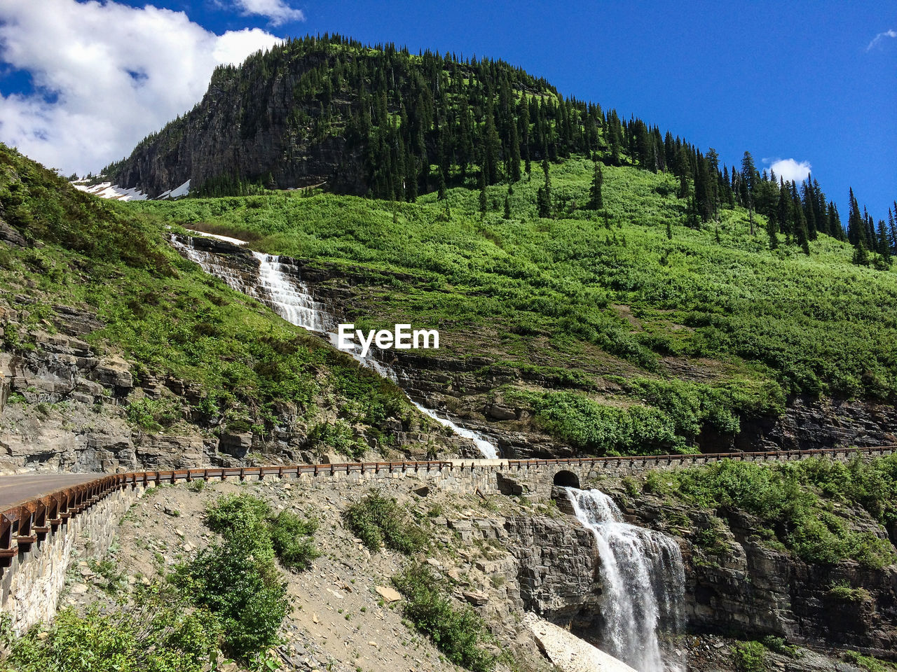 Scenic view of waterfall on mountain