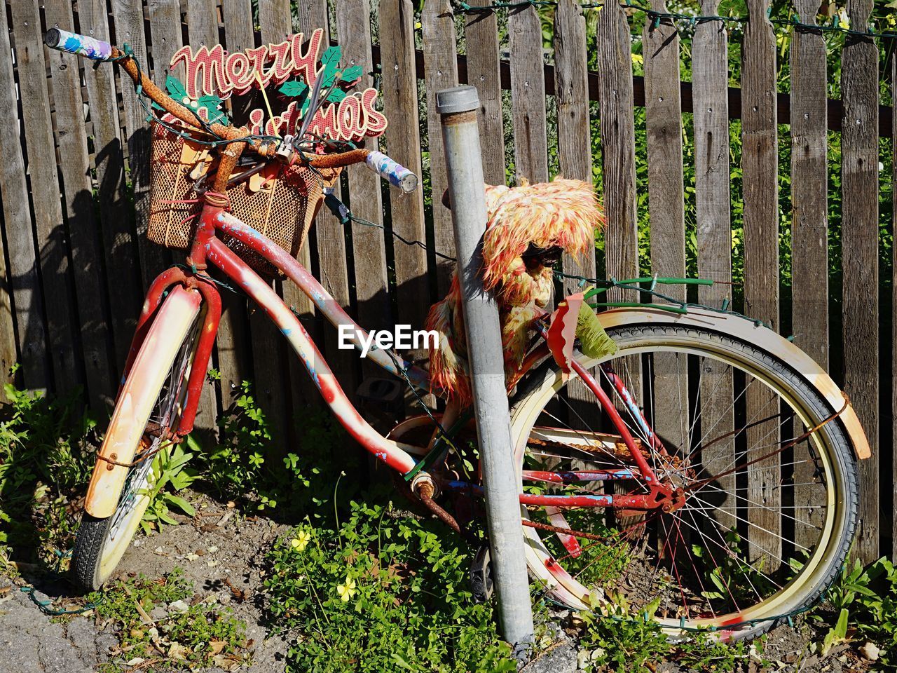 Bicycle against fence