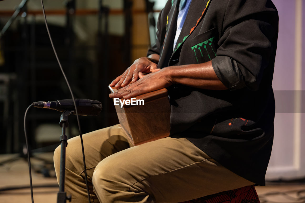 MAN SITTING ON SEAT