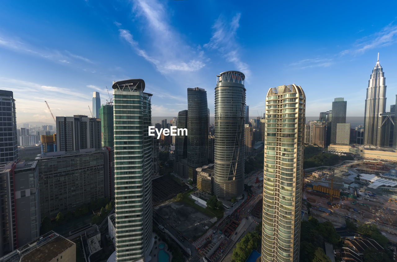 HIGH ANGLE VIEW OF BUILDINGS AGAINST SKY