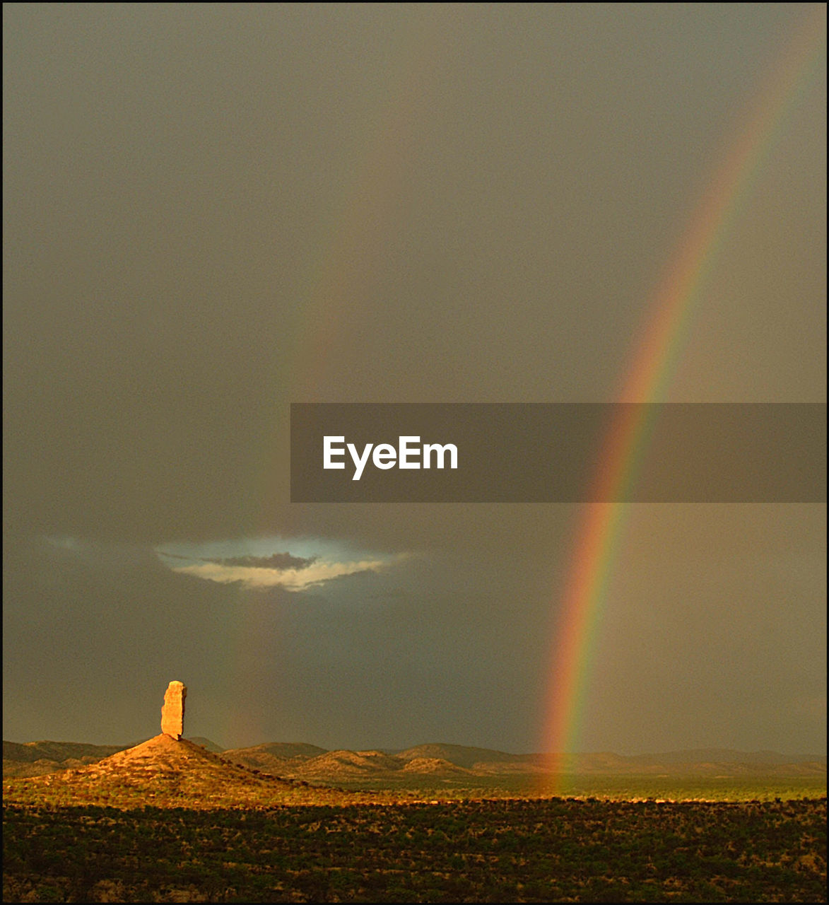 SCENIC VIEW OF RAINBOW OVER LANDSCAPE