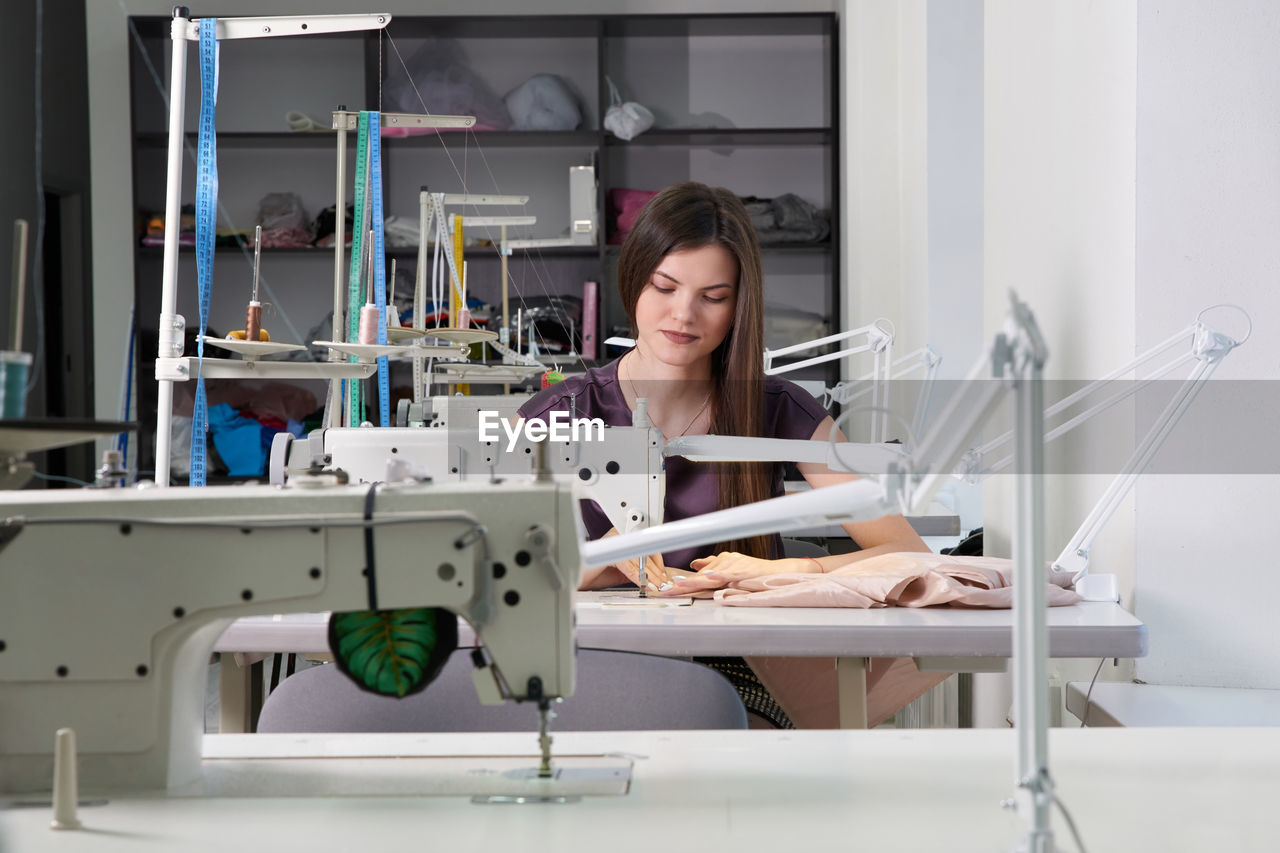 Woman sewing clothes