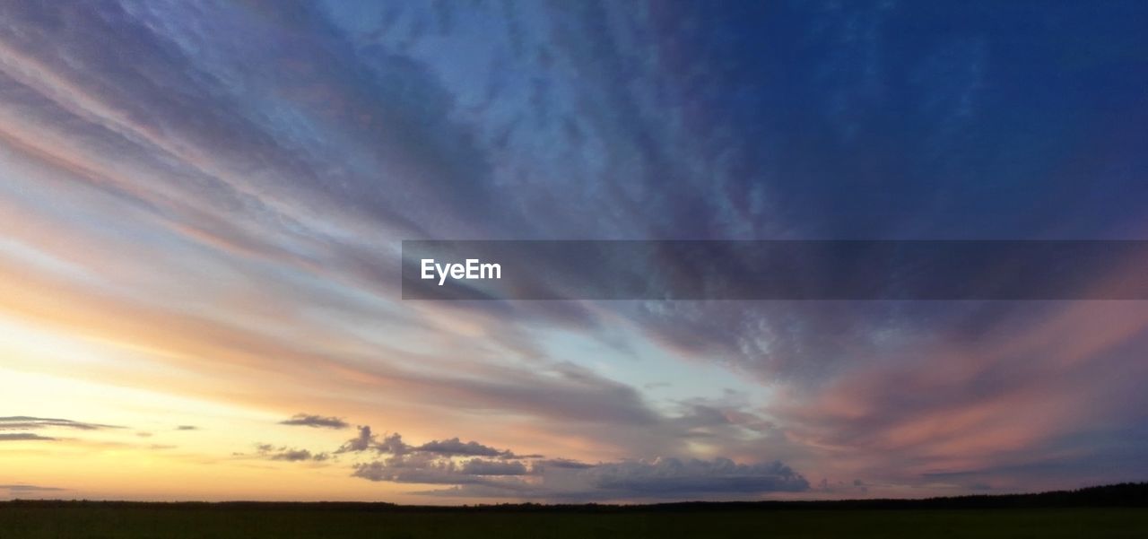 SCENIC VIEW OF DRAMATIC SKY OVER LANDSCAPE