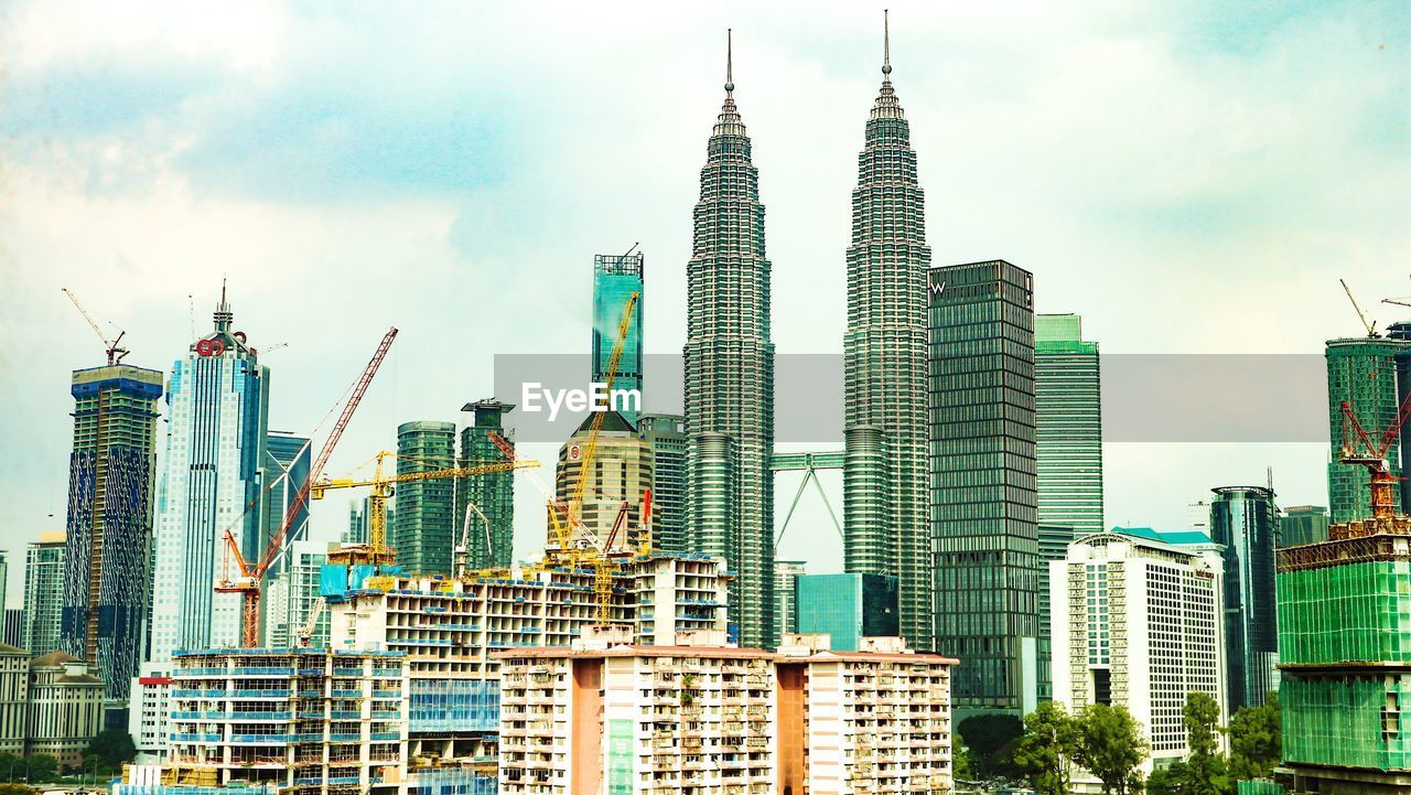 Modern buildings against sky in city