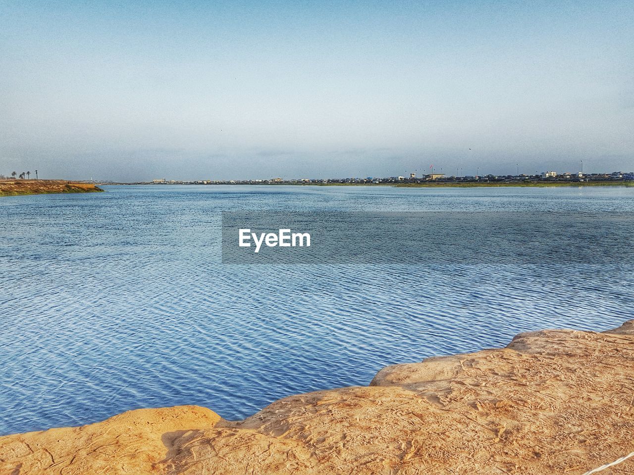 Scenic view of river against clear sky