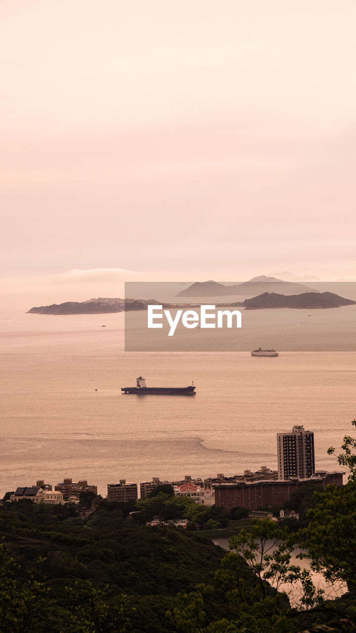 SCENIC VIEW OF BAY DURING SUNSET