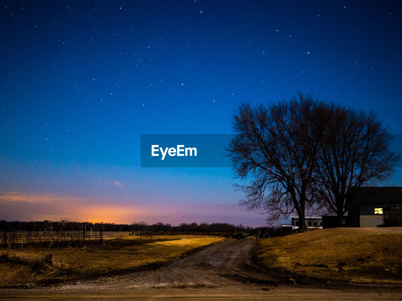 Scenic view of field against sky at night