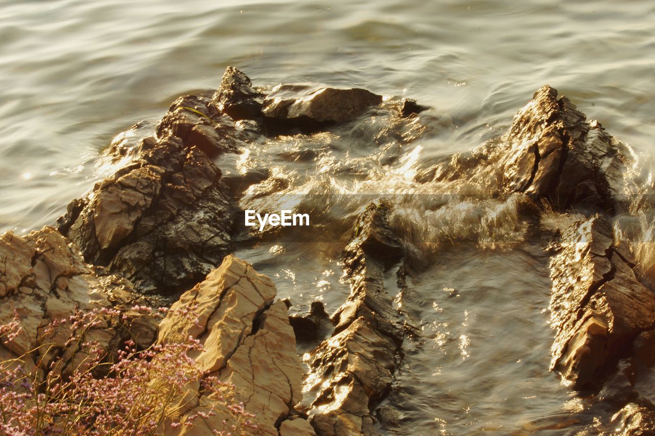 High angle view of rocks in sea