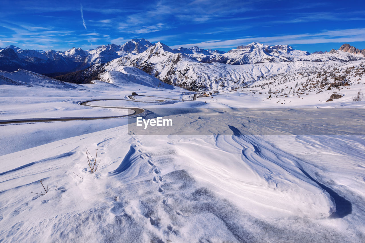 Scenic view of snow covered mountains against sky