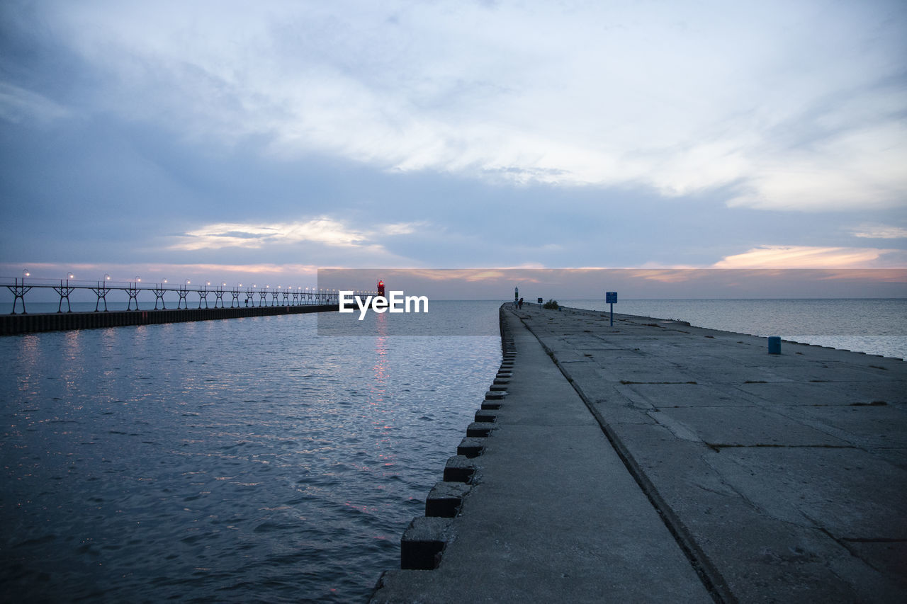 Scenic view of pier and lake michigan  at white haven,  against sky during sunset