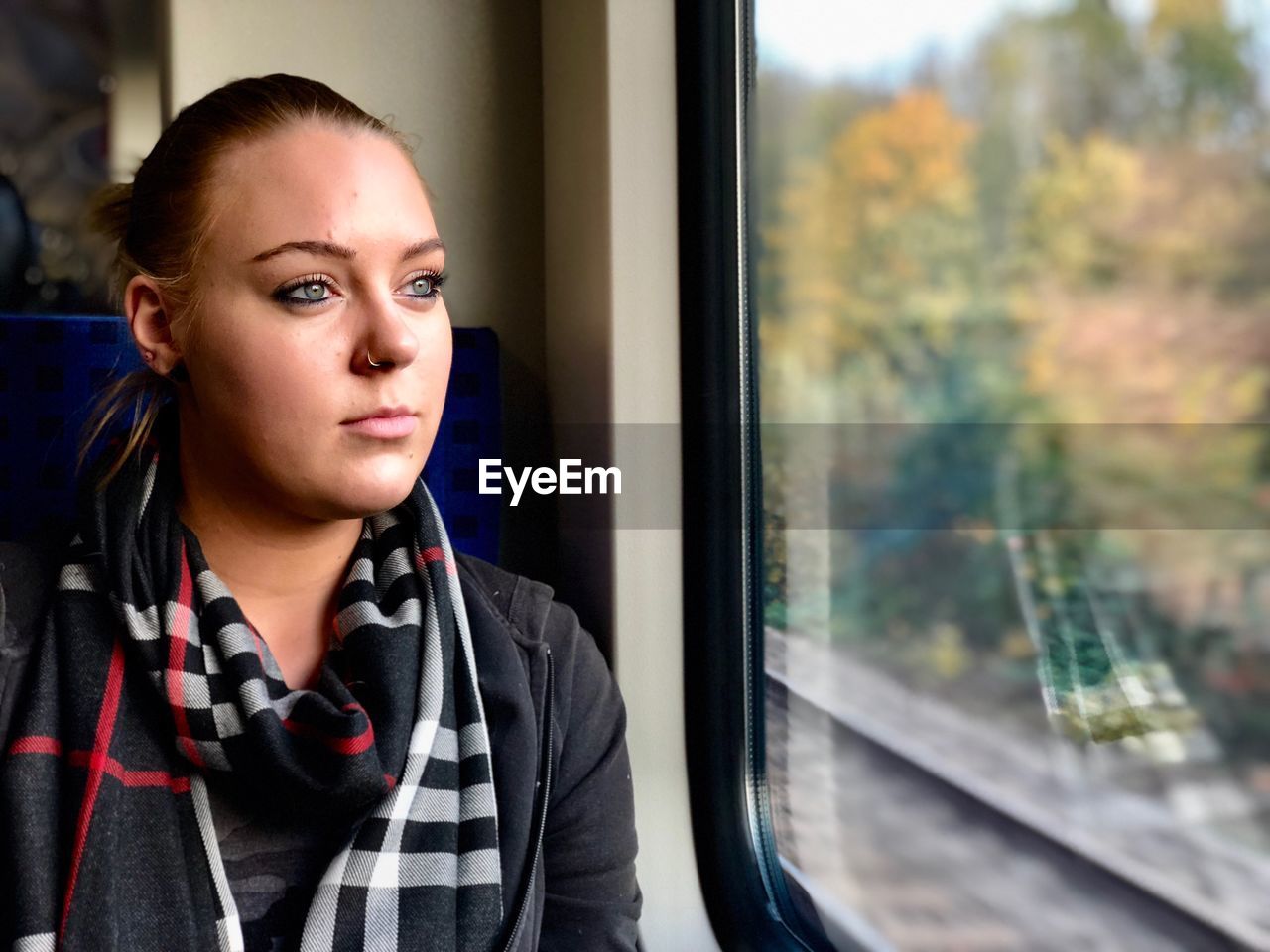 Young woman sitting in train