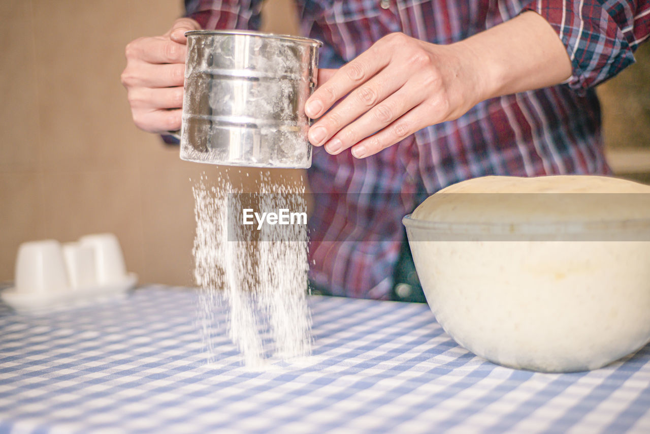 Female hands making yeast pizza dough, kneading dough for homemade bread, female hands and dough