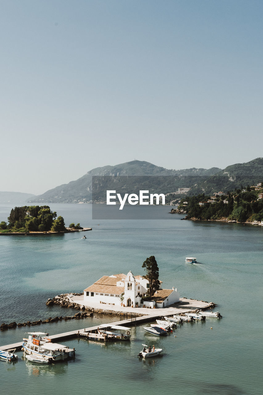 SCENIC VIEW OF BAY IN SEA AGAINST CLEAR SKY