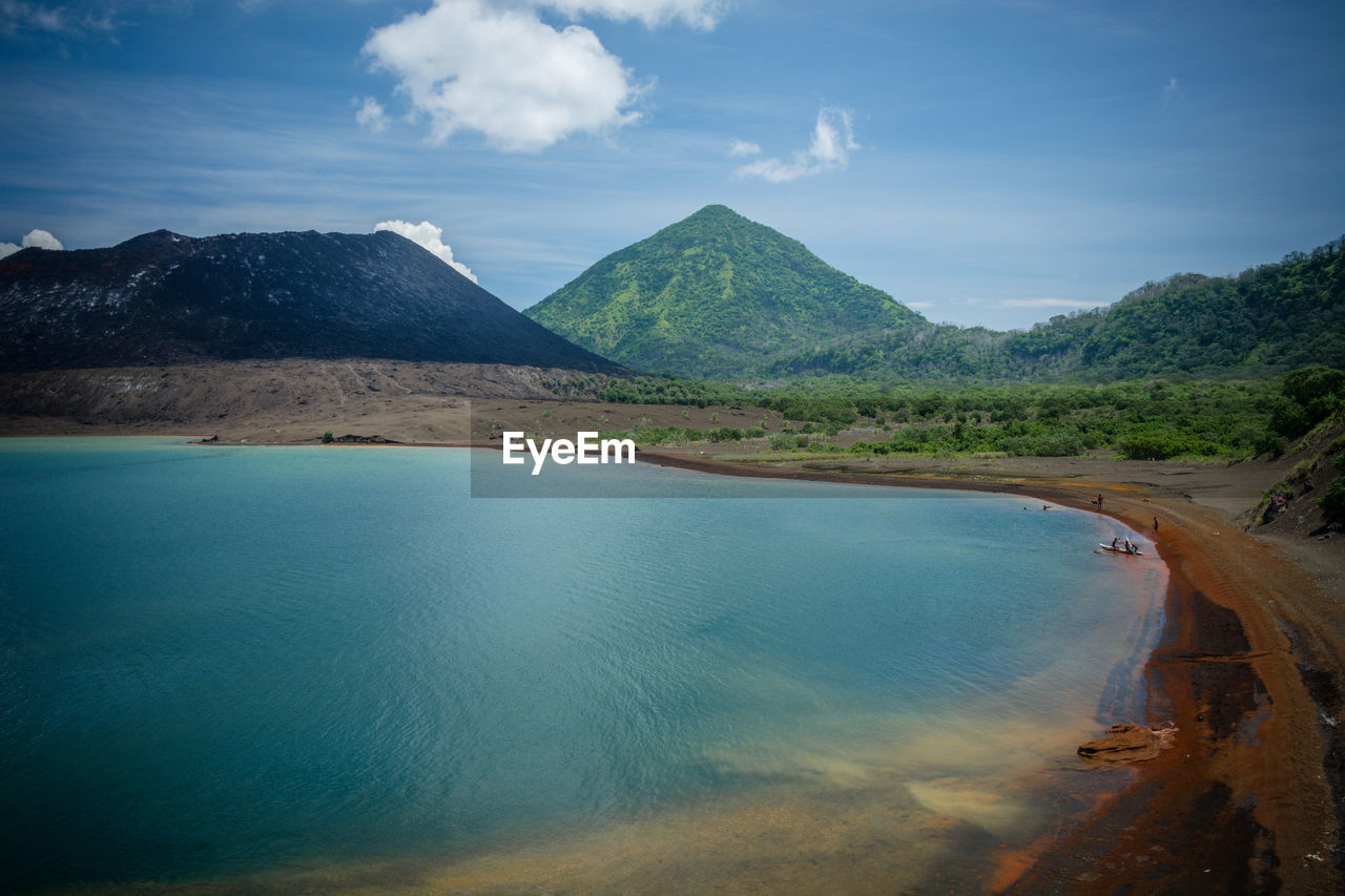 SCENIC VIEW OF LANDSCAPE AND MOUNTAINS AGAINST SKY