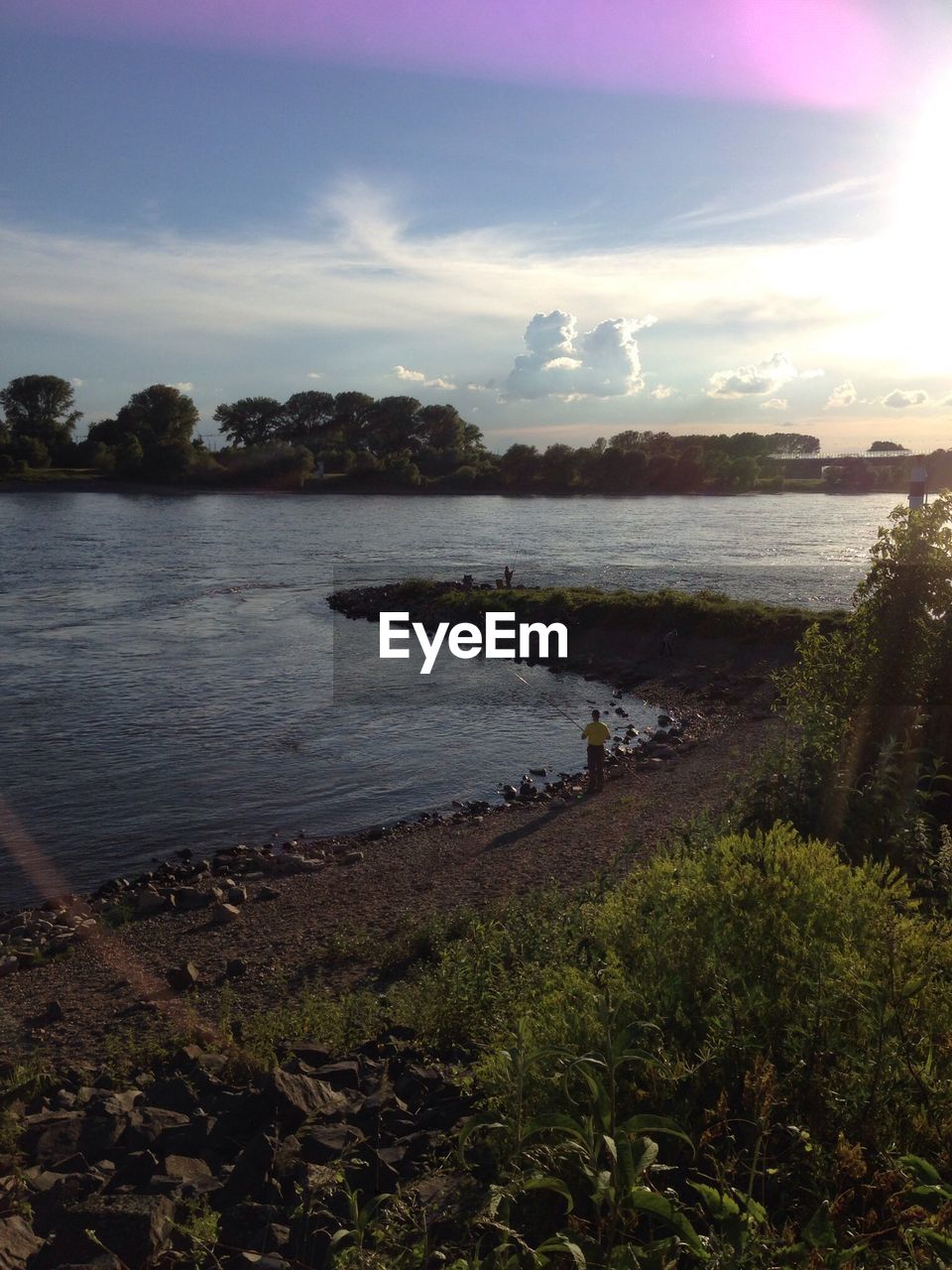 Scenic view of river against during sunset