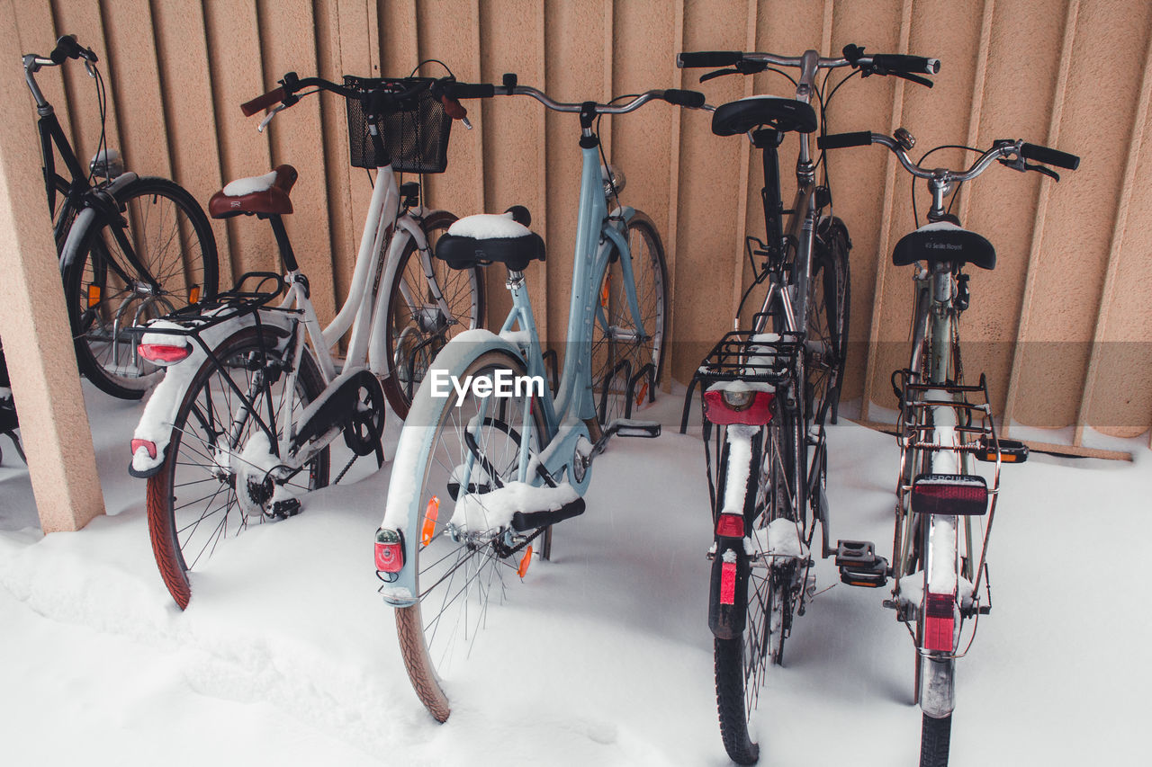 Bicycles on wall in winter